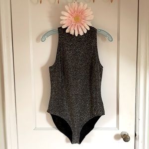 H&M sparkly silver and black turtle neck body suit